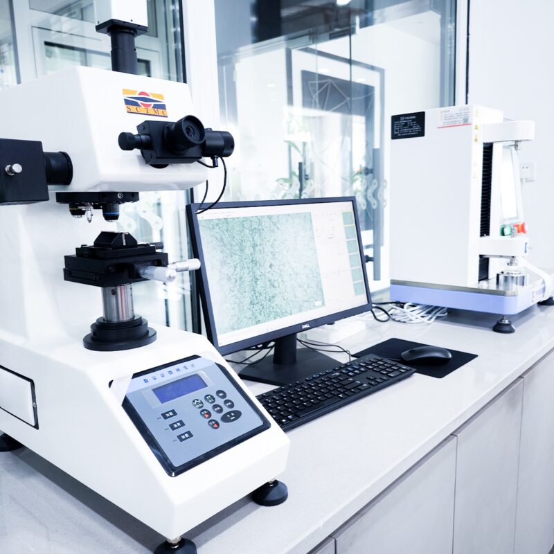 03我们的优势-Motorcycle & Chainsaw Chain Manufacturing | HCC CHAIN Advantages Laboratory microscope and imaging computer used for materials examination